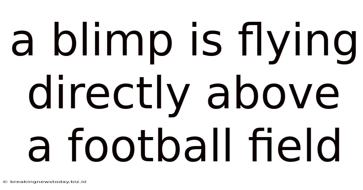A Blimp Is Flying Directly Above A Football Field