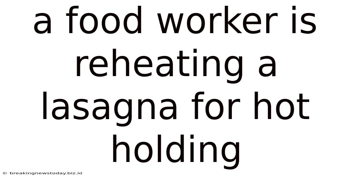 A Food Worker Is Reheating A Lasagna For Hot Holding