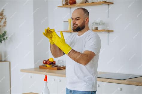 A Food Worker Puts On A Clean Pair Of Gloves